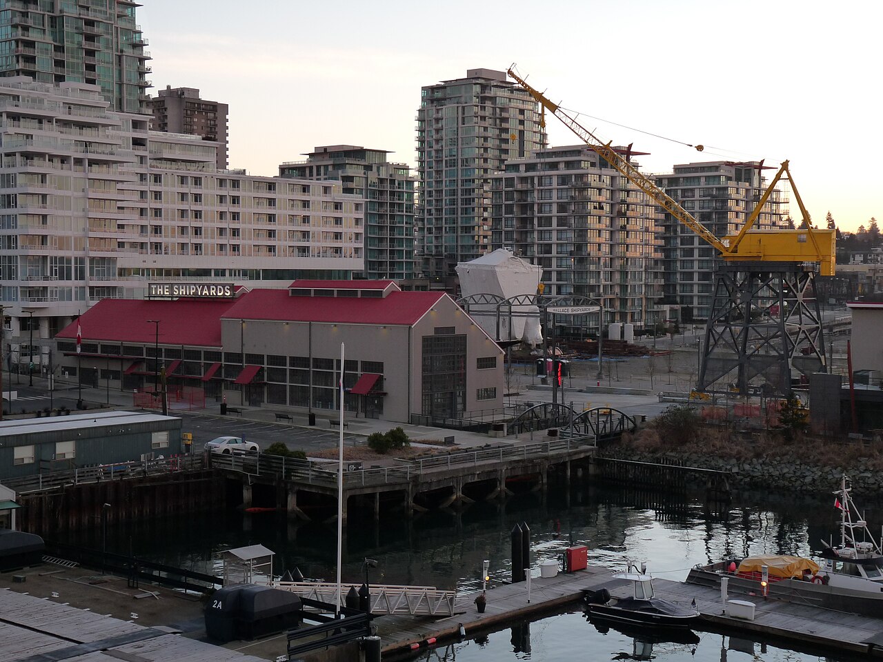 The Shipyards in North Vancouver, with the red-roofed building and the yellow crane